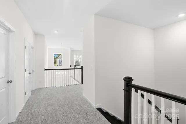 a view of a hallway with a window