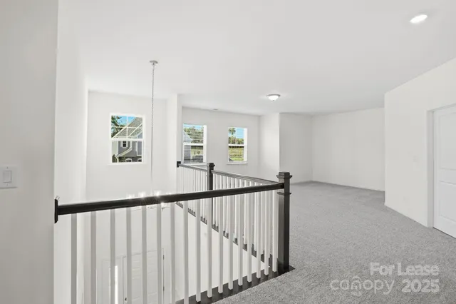a view of staircase with rug floor