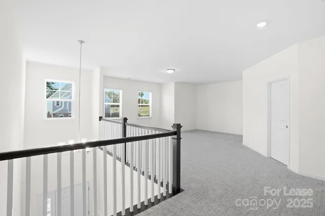 a view of a hallway with windows