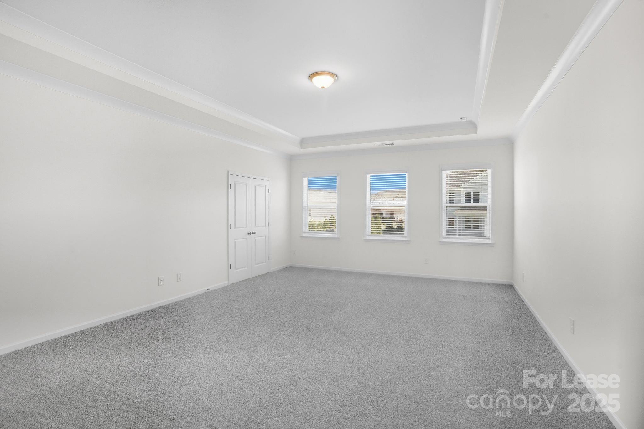 10205 Whitaker Pointe Drive Huntersville, NC 28078 - Photo 47 of 48 an empty room with windows