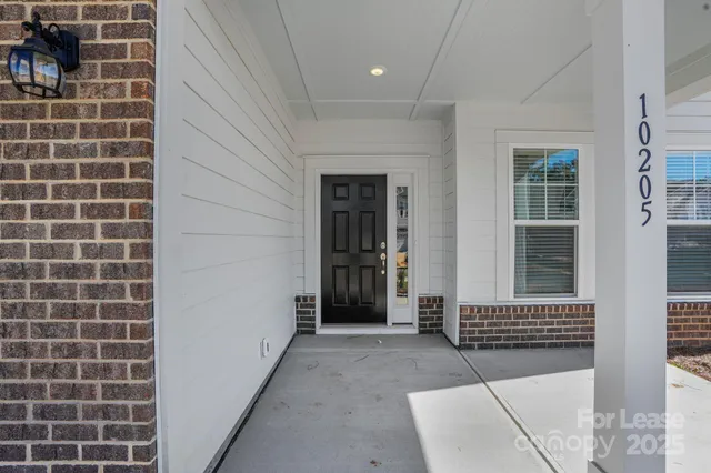 a view of a bedroom with windows