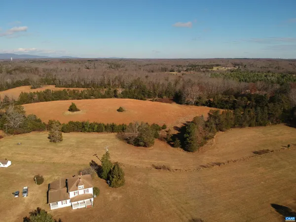an aerial view of ocean and residential houses