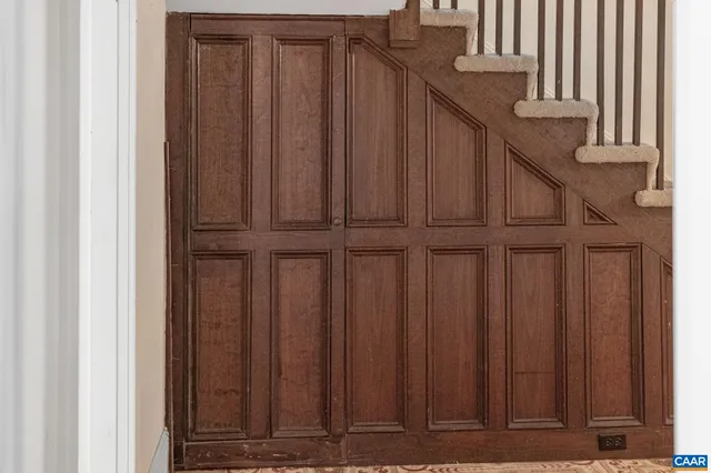 a living room with furniture fireplace and a wooden floor