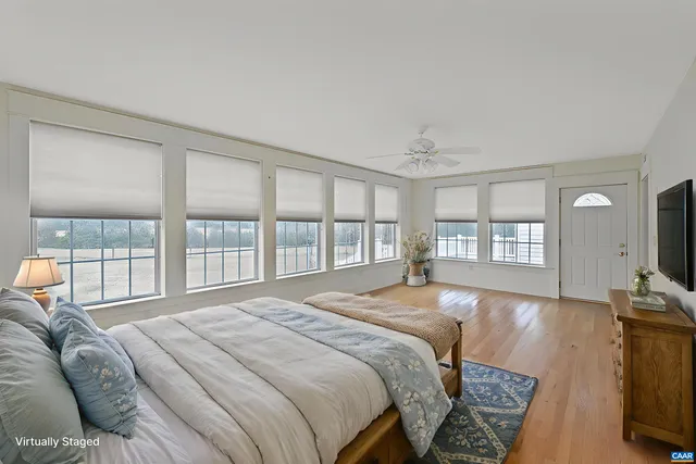 a living room with a fireplace and a rug