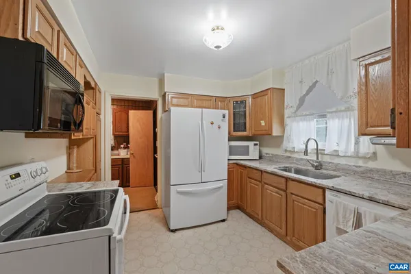 a bathroom with a toilet sink and shower