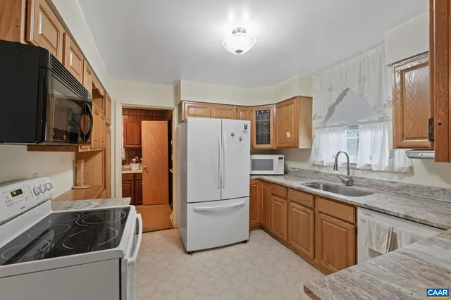 a bathroom with a toilet sink and shower