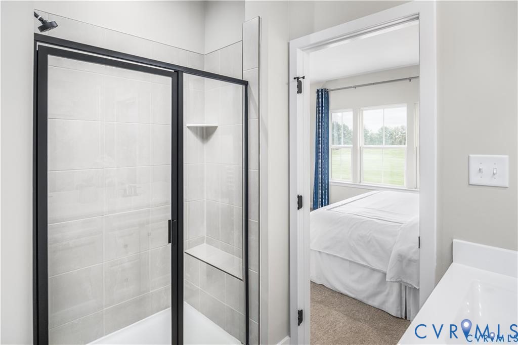 12705 Red Clover Way Midlothian, VA 23112 - Photo 17 of 27 a room with a bed and a glass door