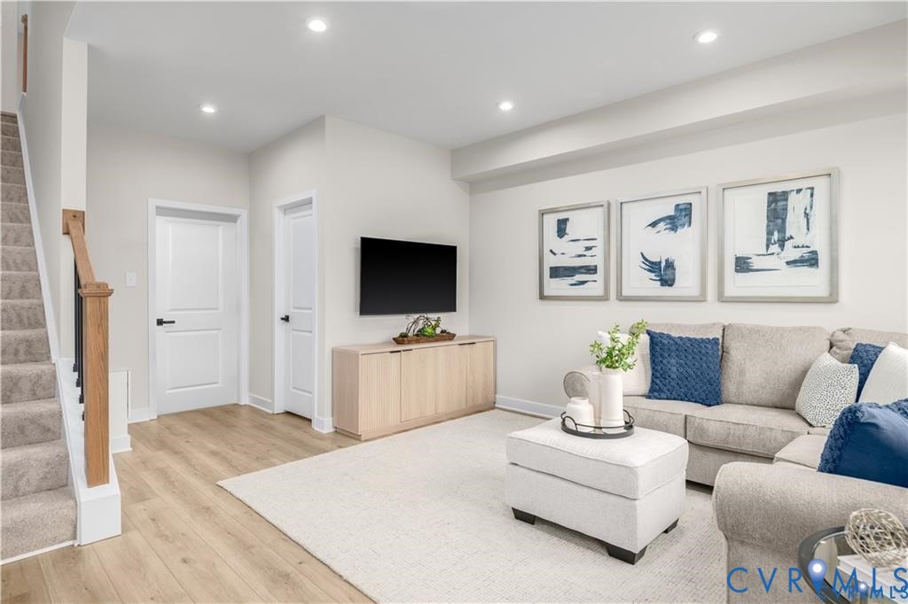 12705 Red Clover Way Midlothian, VA 23112 - Photo 6 of 27 a living room with furniture and a flat screen tv