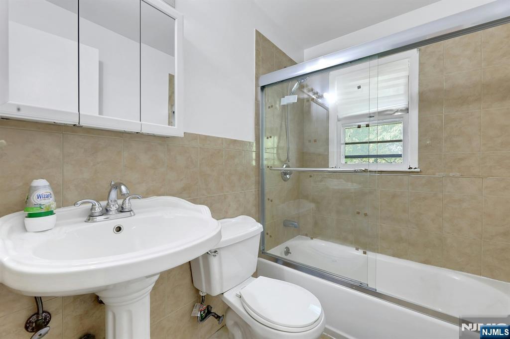 20 Blue Hill Road Norwood, NJ 07648 - Photo 38 of 49 a bathroom with a sink a toilet and shower