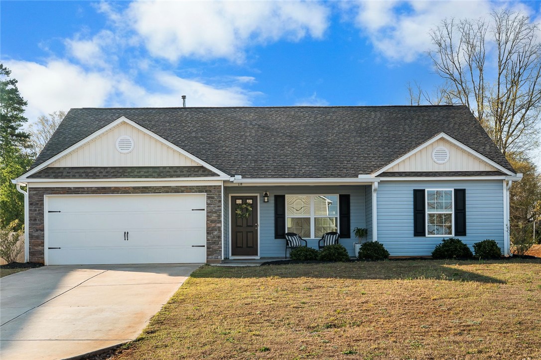 114 Sunny Pt Loop Central, SC 29630 - Photo 1 of 25 This inviting home presents a classic facade with a welcoming entrance and mature landscaping.