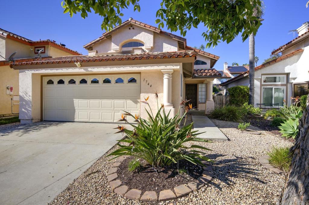 1744 Via Allena Oceanside, CA 92056 - Photo 1 of 36 a front view of a house with a garden
