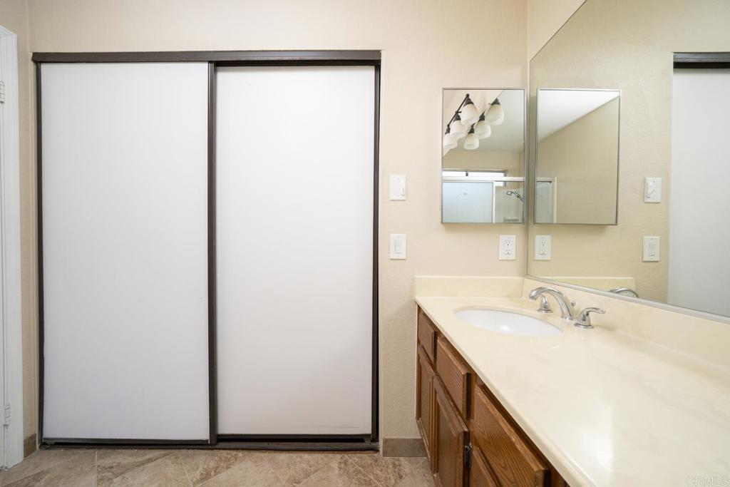 1744 Via Allena Oceanside, CA 92056 - Photo 18 of 36 a bathroom with a sink and a mirror