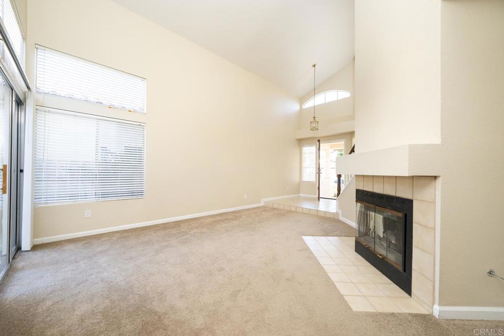 1744 Via Allena Oceanside, CA 92056 - Photo 19 of 36 an empty room with windows and fireplace