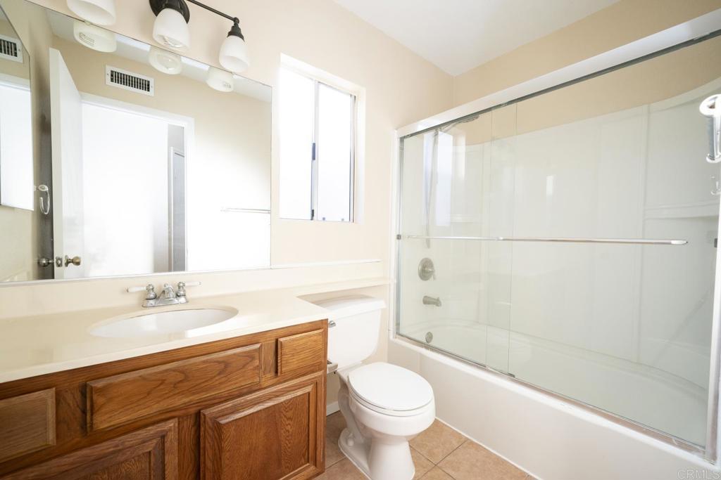 1744 Via Allena Oceanside, CA 92056 - Photo 26 of 36 a bathroom with a sink a toilet and shower