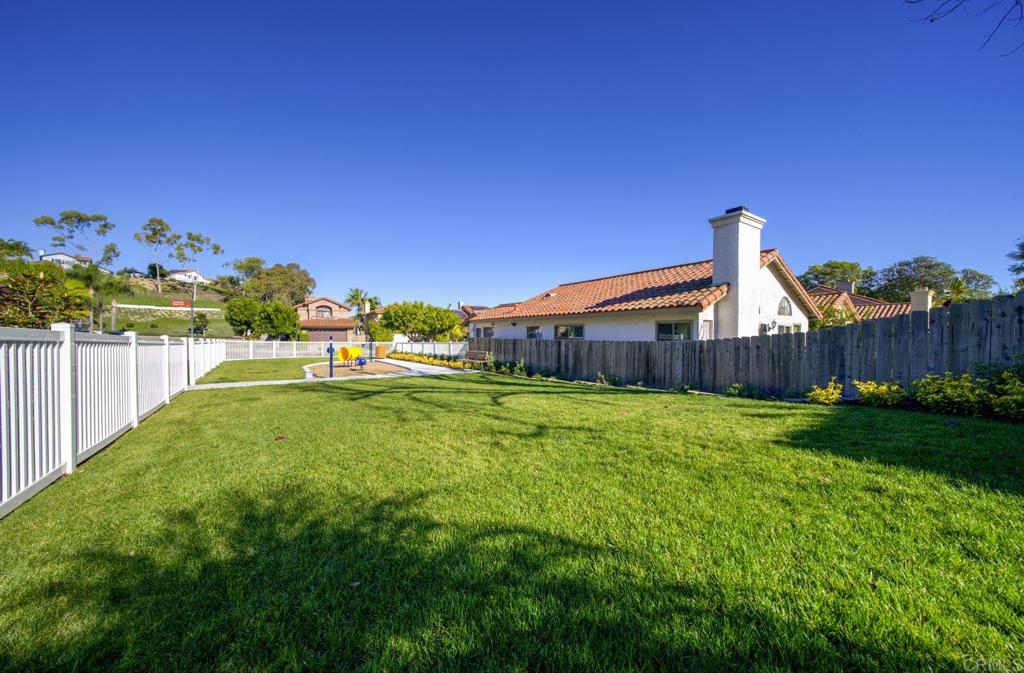 1744 Via Allena Oceanside, CA 92056 - Photo 34 of 36 a house view with a play ground and outdoor space