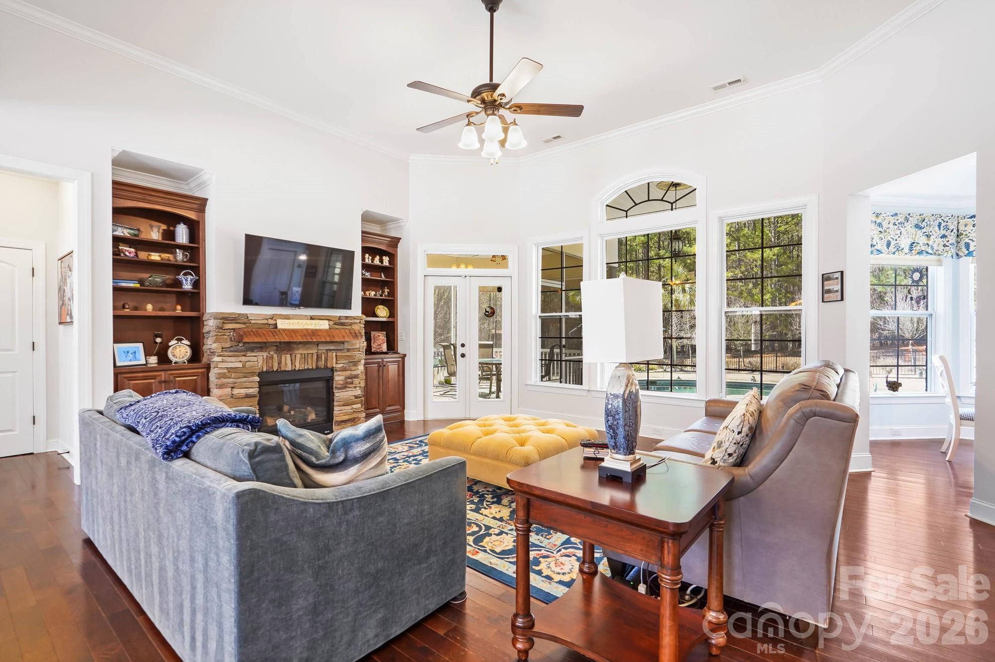 5312 Johnsons Barn Road York, SC 29745 - Photo 13 of 46 a living room with furniture a fireplace and a flat screen tv