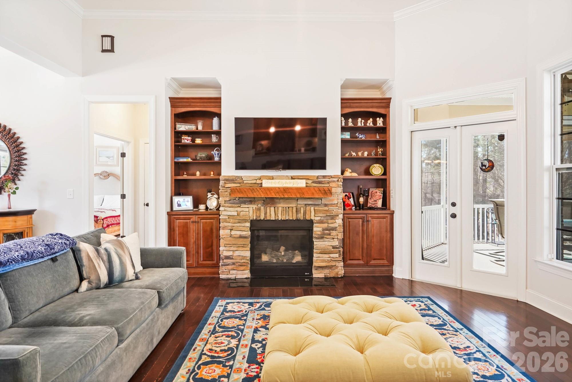 5312 Johnsons Barn Road York, SC 29745 - Photo 14 of 46 a living room with furniture a flat screen tv and a fireplace