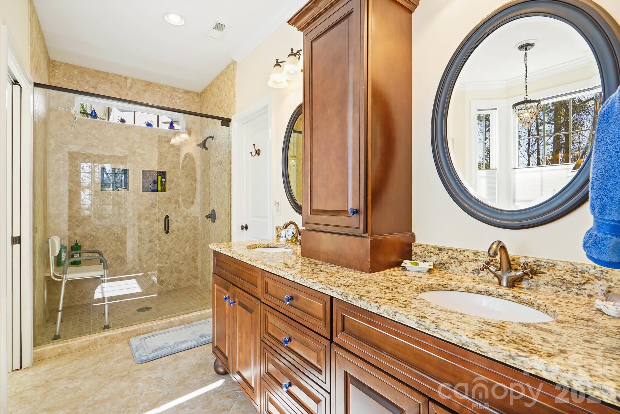 5312 Johnsons Barn Road York, SC 29745 - Photo 25 of 46 a bathroom with a granite countertop double vanity sink and a mirror