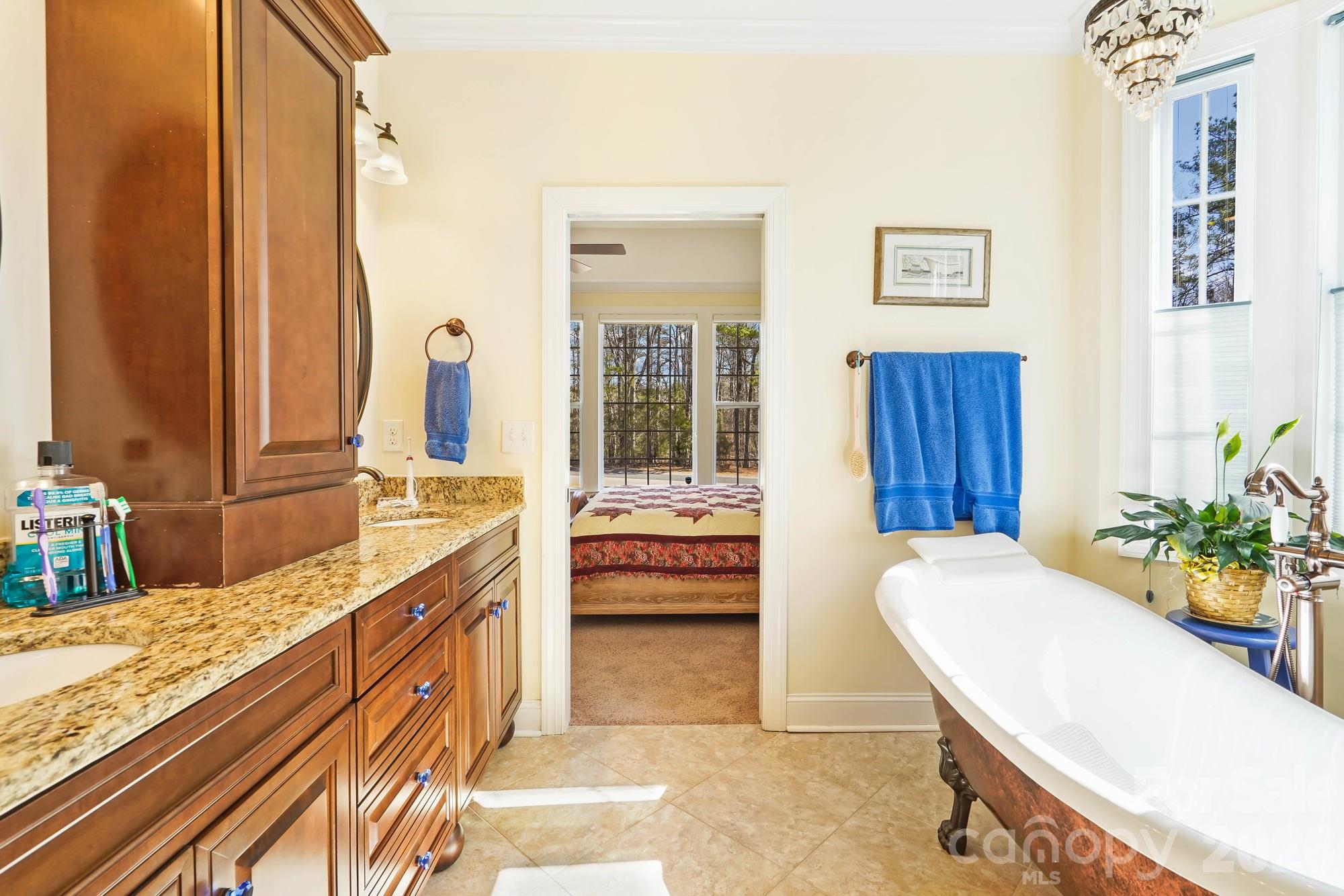 5312 Johnsons Barn Road York, SC 29745 - Photo 28 of 46 a spacious bathroom with a tub sink and mirror
