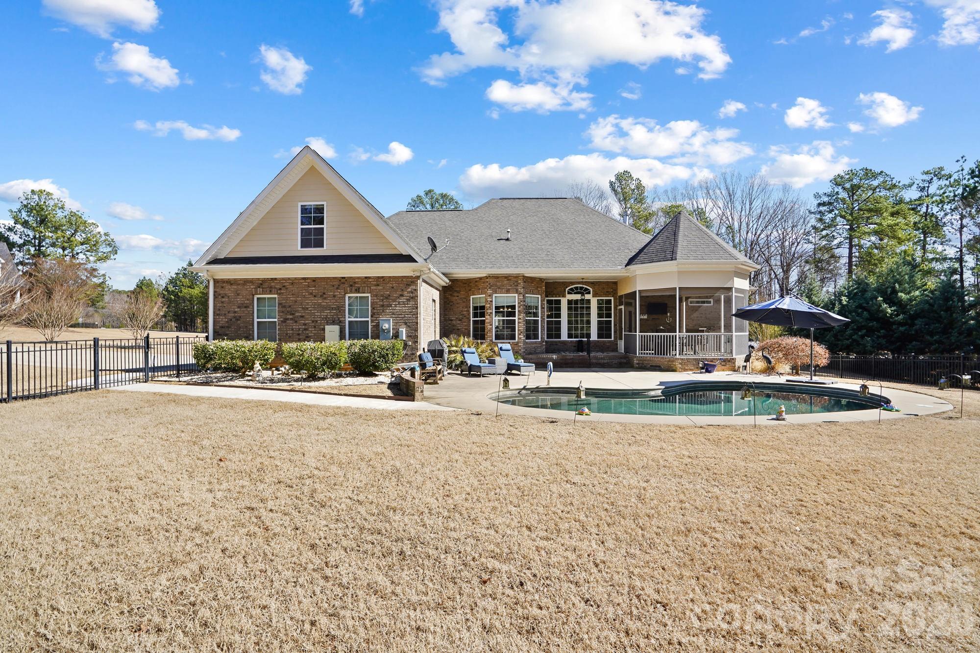 5312 Johnsons Barn Road York, SC 29745 - Photo 3 of 46 a front view of a house with swimming pool