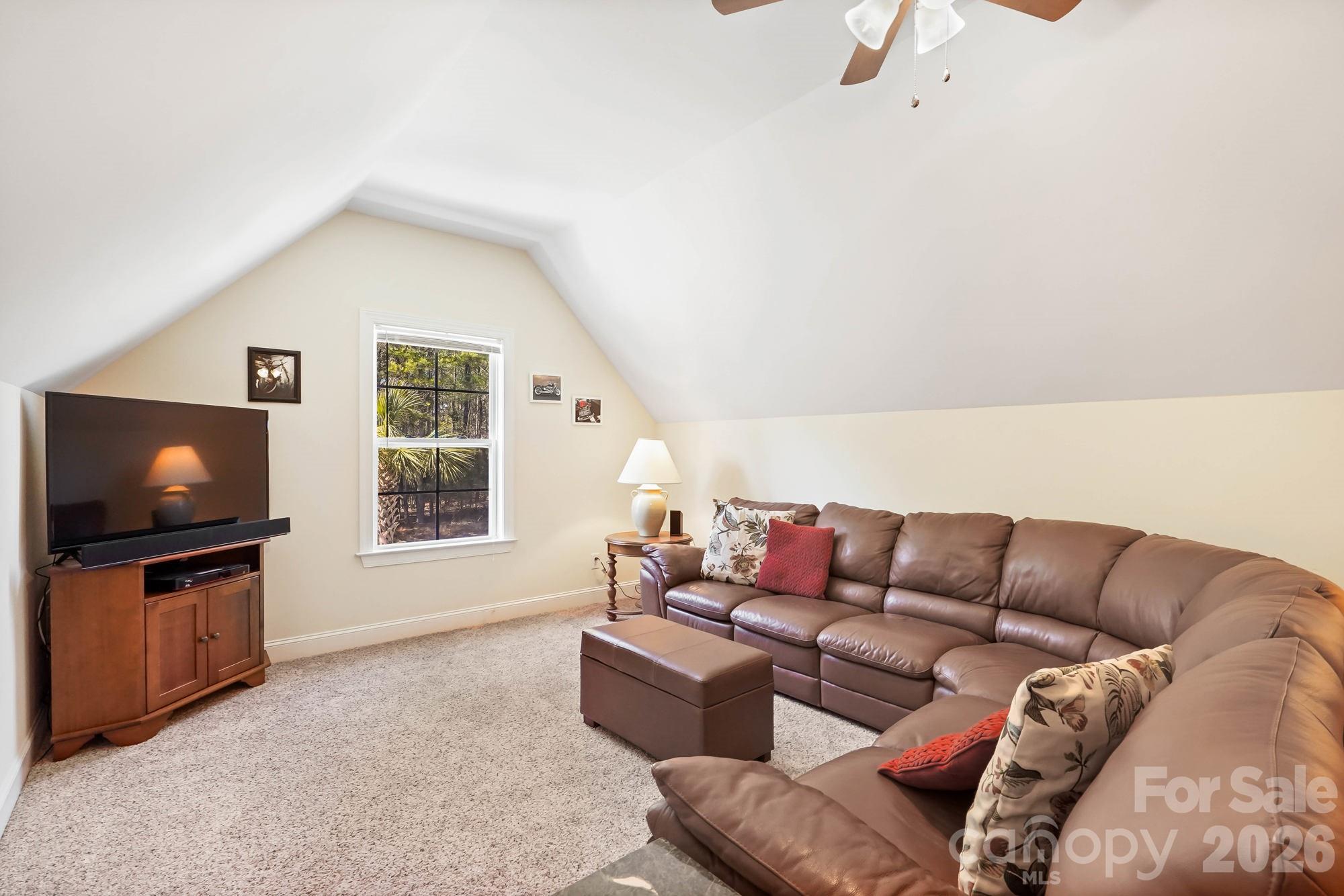5312 Johnsons Barn Road York, SC 29745 - Photo 34 of 46 a living room with furniture a flat screen tv and a window