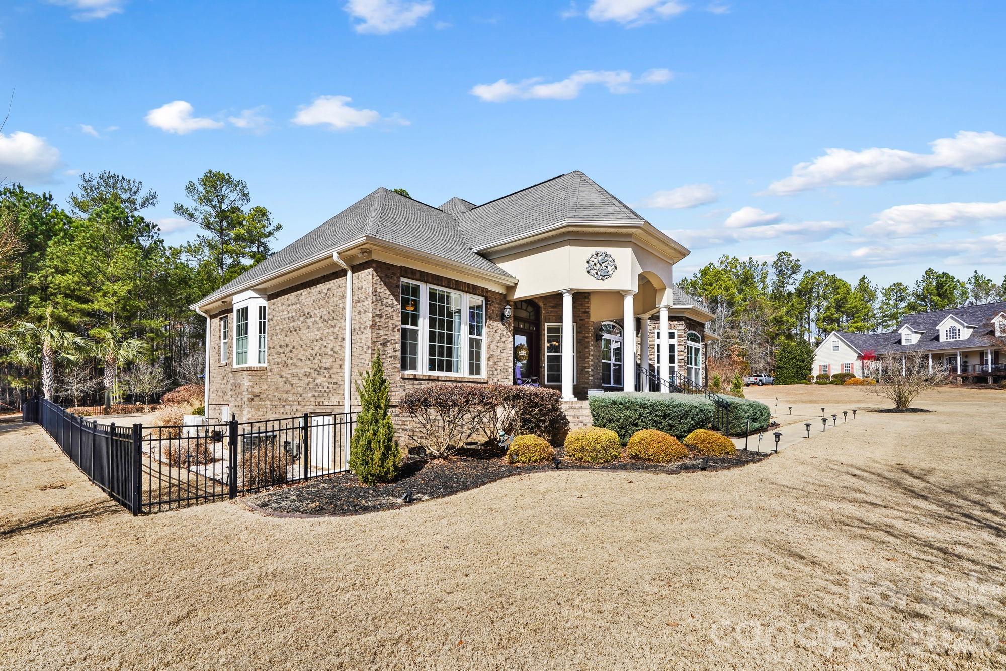 5312 Johnsons Barn Road York, SC 29745 - Photo 4 of 46 a front view of a house with a yard