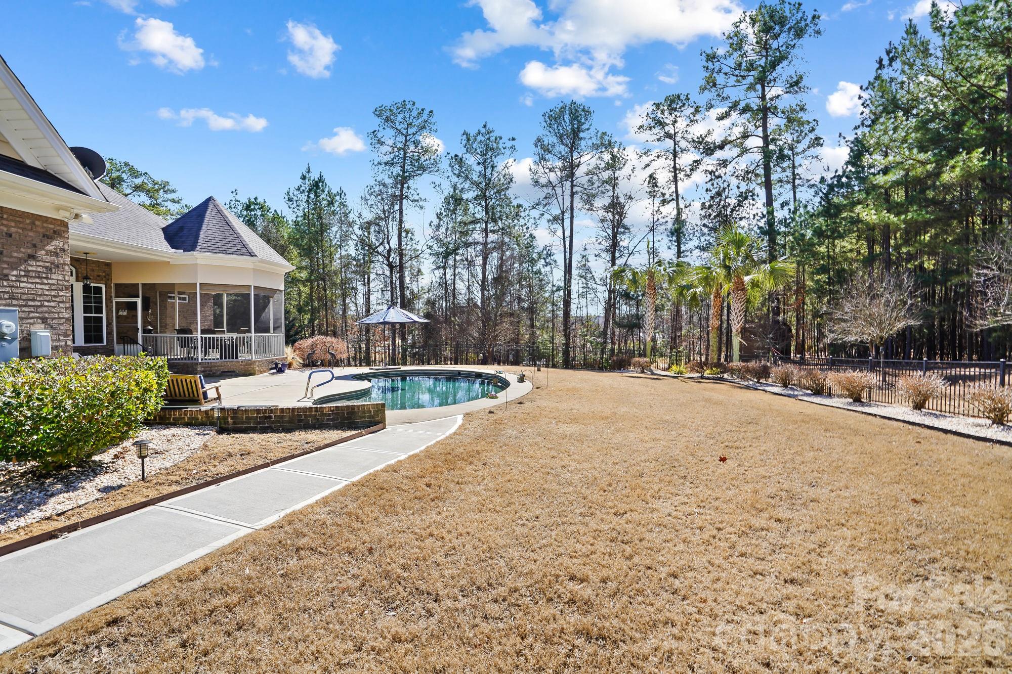 5312 Johnsons Barn Road York, SC 29745 - Photo 42 of 46 a swimming pool with outdoor seating and yard