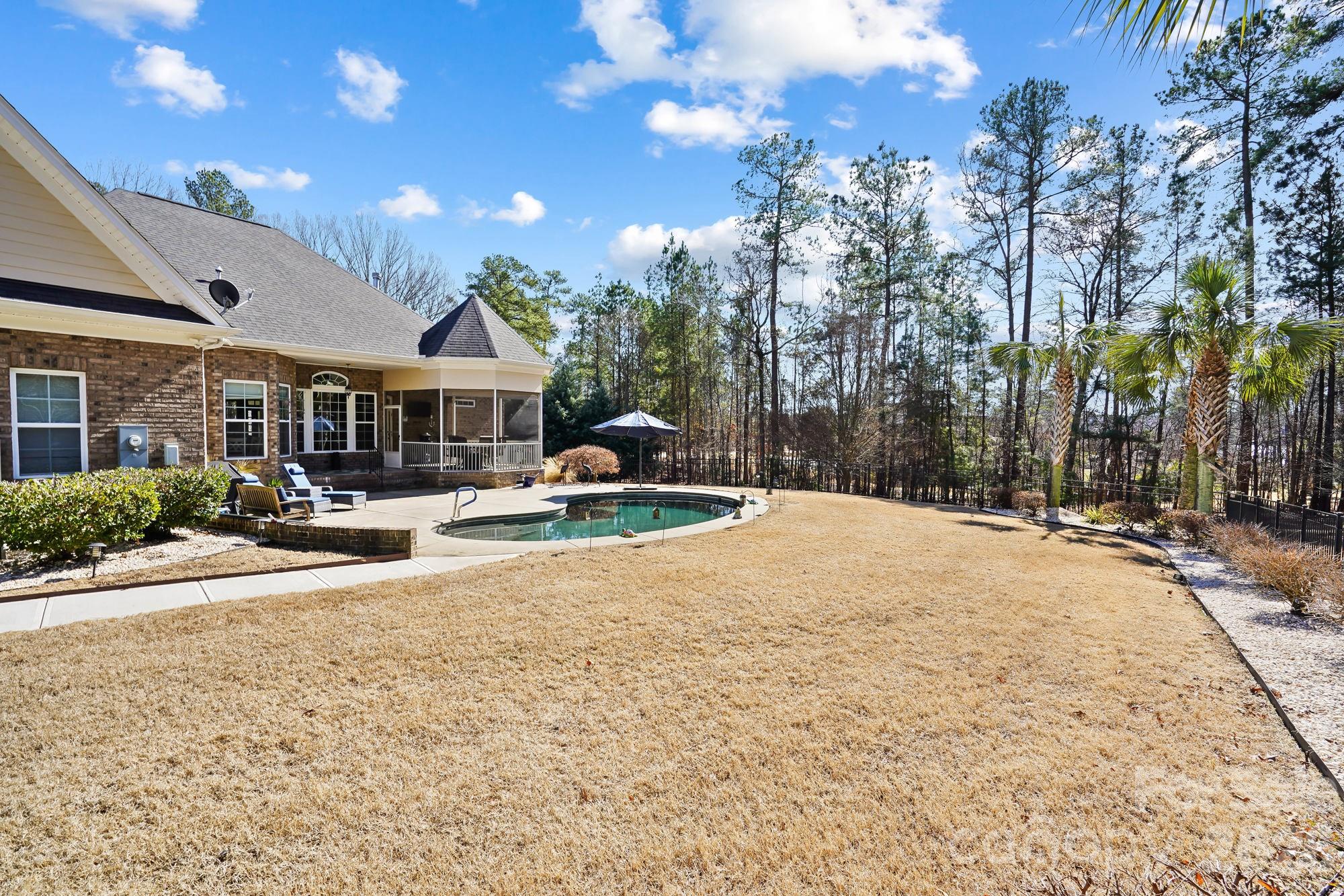 5312 Johnsons Barn Road York, SC 29745 - Photo 44 of 46 a swimming pool with outdoor seating and yard