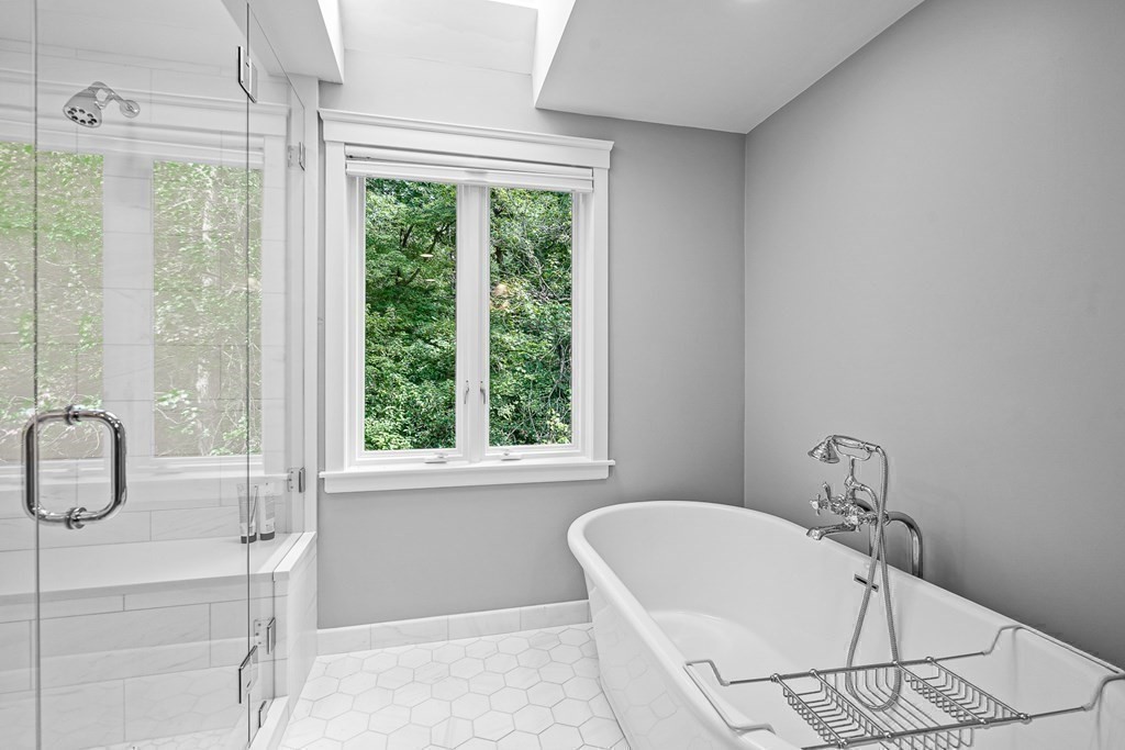 118 Hundreds Road Wellesley, MA 02481 - Photo 24 of 35 a white bath tub sitting next to a window