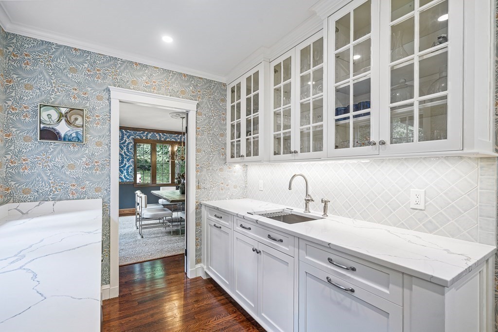 118 Hundreds Road Wellesley, MA 02481 - Photo 8 of 35 a kitchen with a sink stove and cabinets