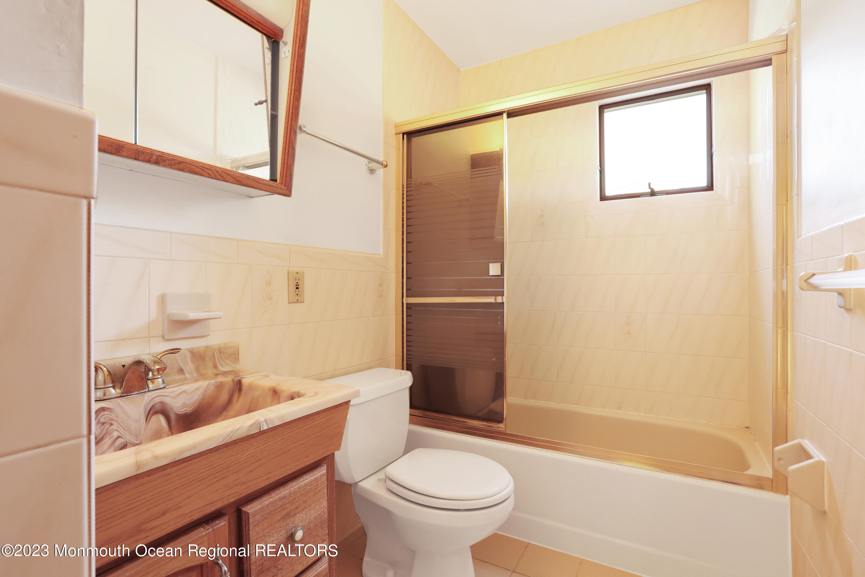 13 Scholer Drive Union Beach, NJ 07735 - Photo 19 of 30 a bathroom with a sink a toilet and shower