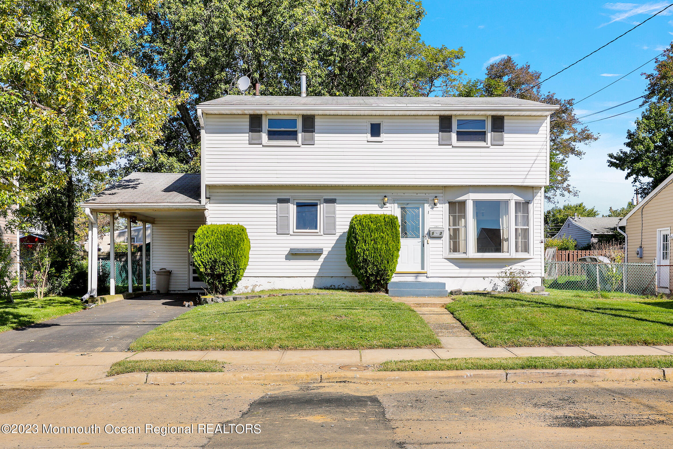 13 Scholer Drive Union Beach, NJ 07735 - Photo 2 of 30 a front view of a house with a yard