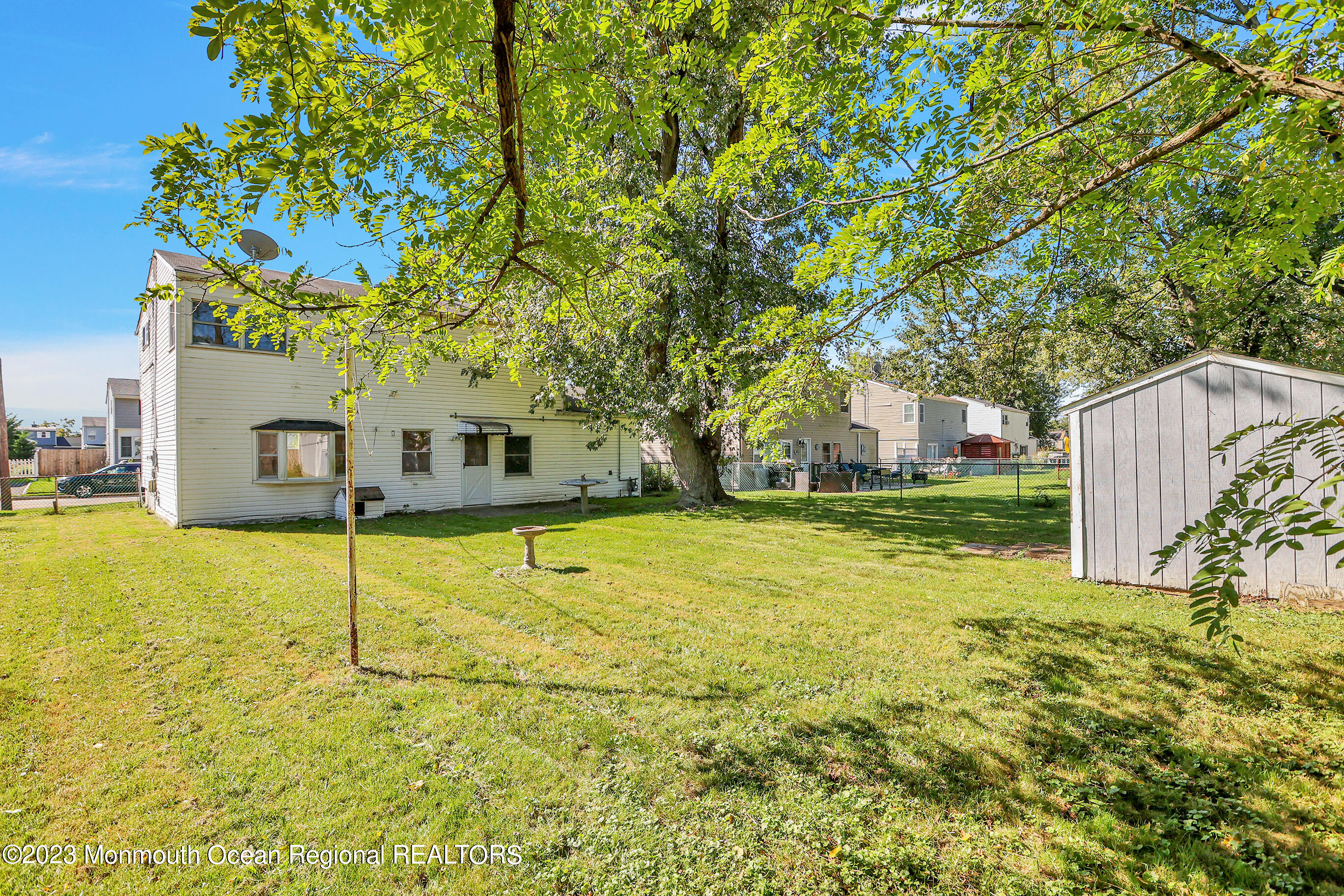 13 Scholer Drive Union Beach, NJ 07735 - Photo 23 of 30 a house view with swimming pool in front of it