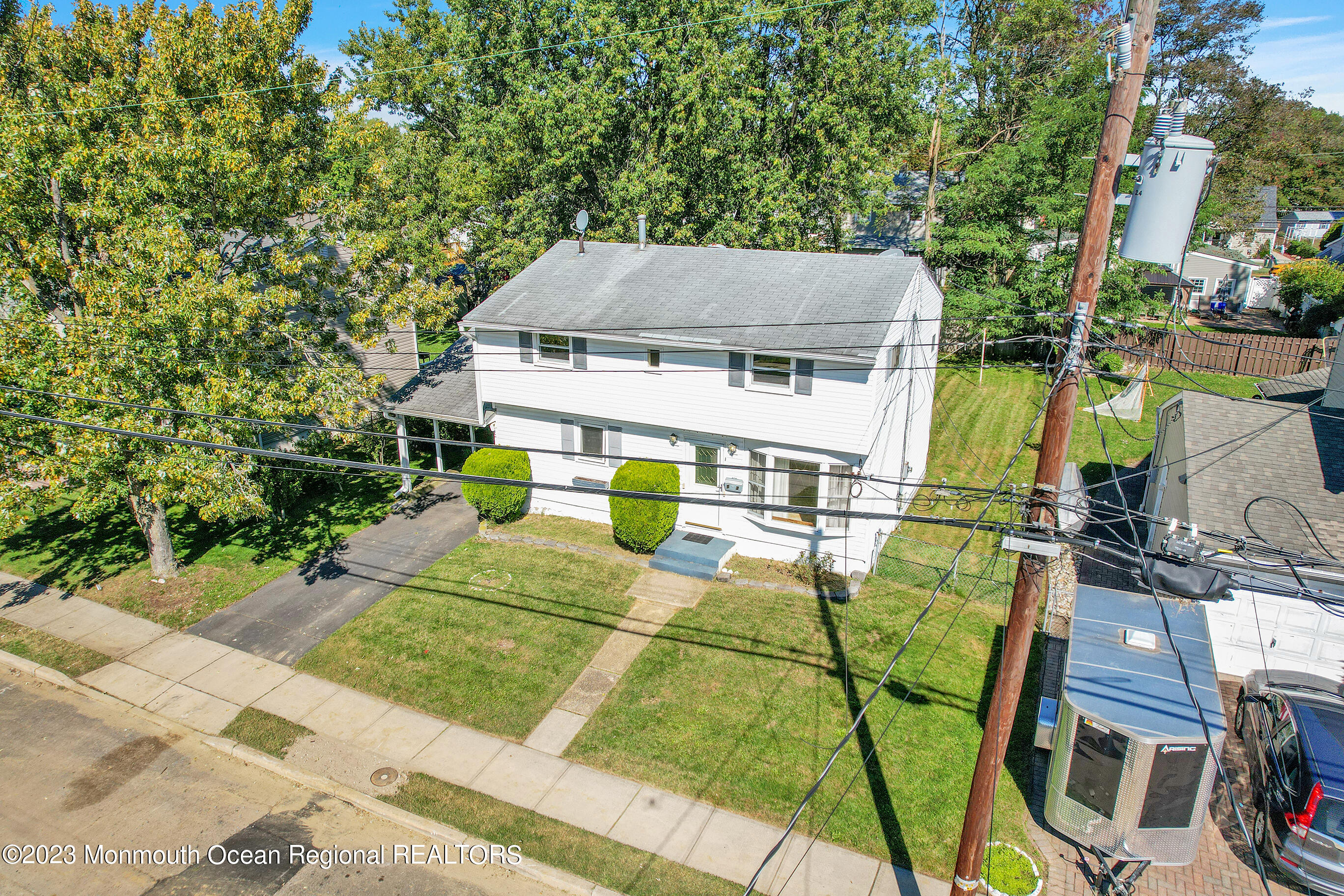 13 Scholer Drive Union Beach, NJ 07735 - Photo 25 of 30 a view of a house with pool and chairs