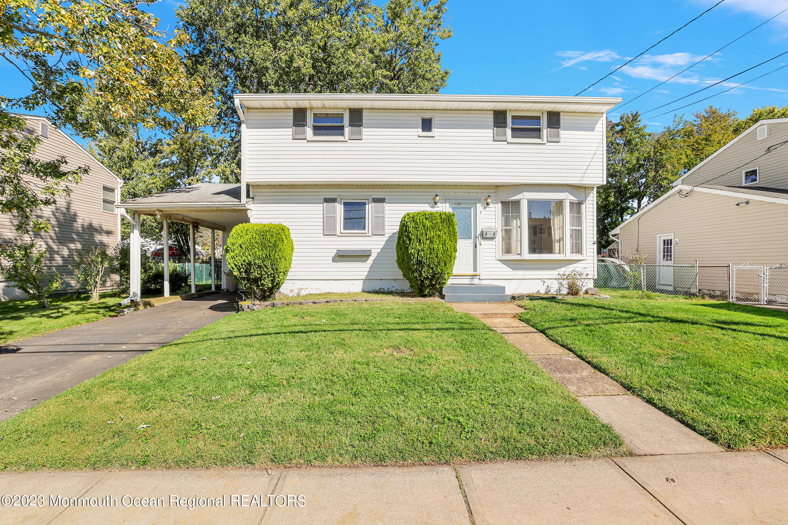 13 Scholer Drive Union Beach, NJ 07735 - Photo 3 of 30 a front view of a house with garden