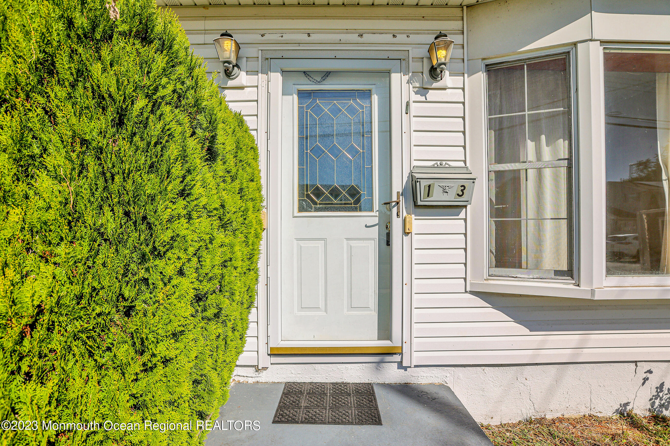 13 Scholer Drive Union Beach, NJ 07735 - Photo 4 of 30 a front view of a house with a garden