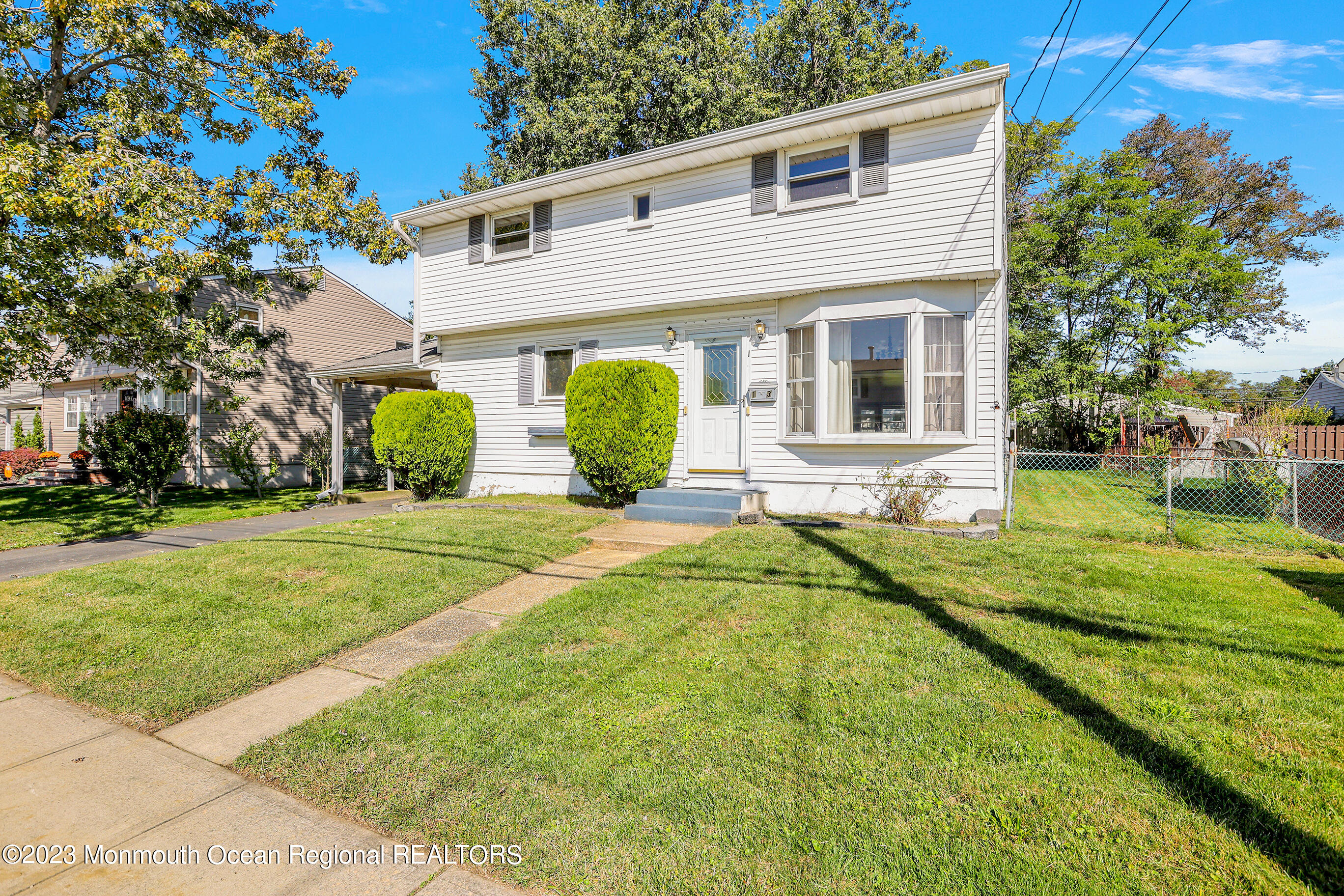 13 Scholer Drive Union Beach, NJ 07735 - Photo 5 of 30 a front view of house with yard and green space