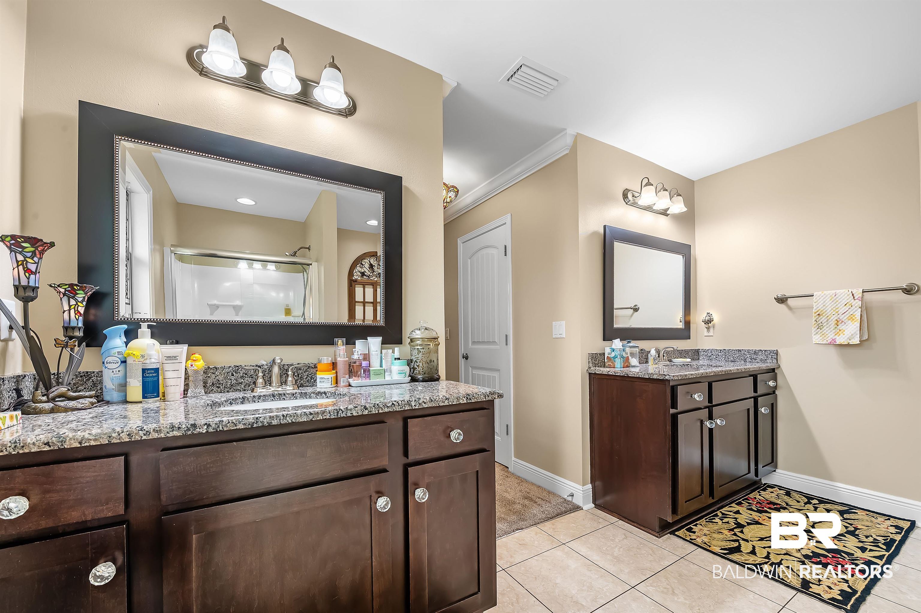 2033 Bourbon Street Foley, AL 36535 - Photo 45 of 57 Bathroom with crown molding, vanity, walk in shower, and tile patterned flooring