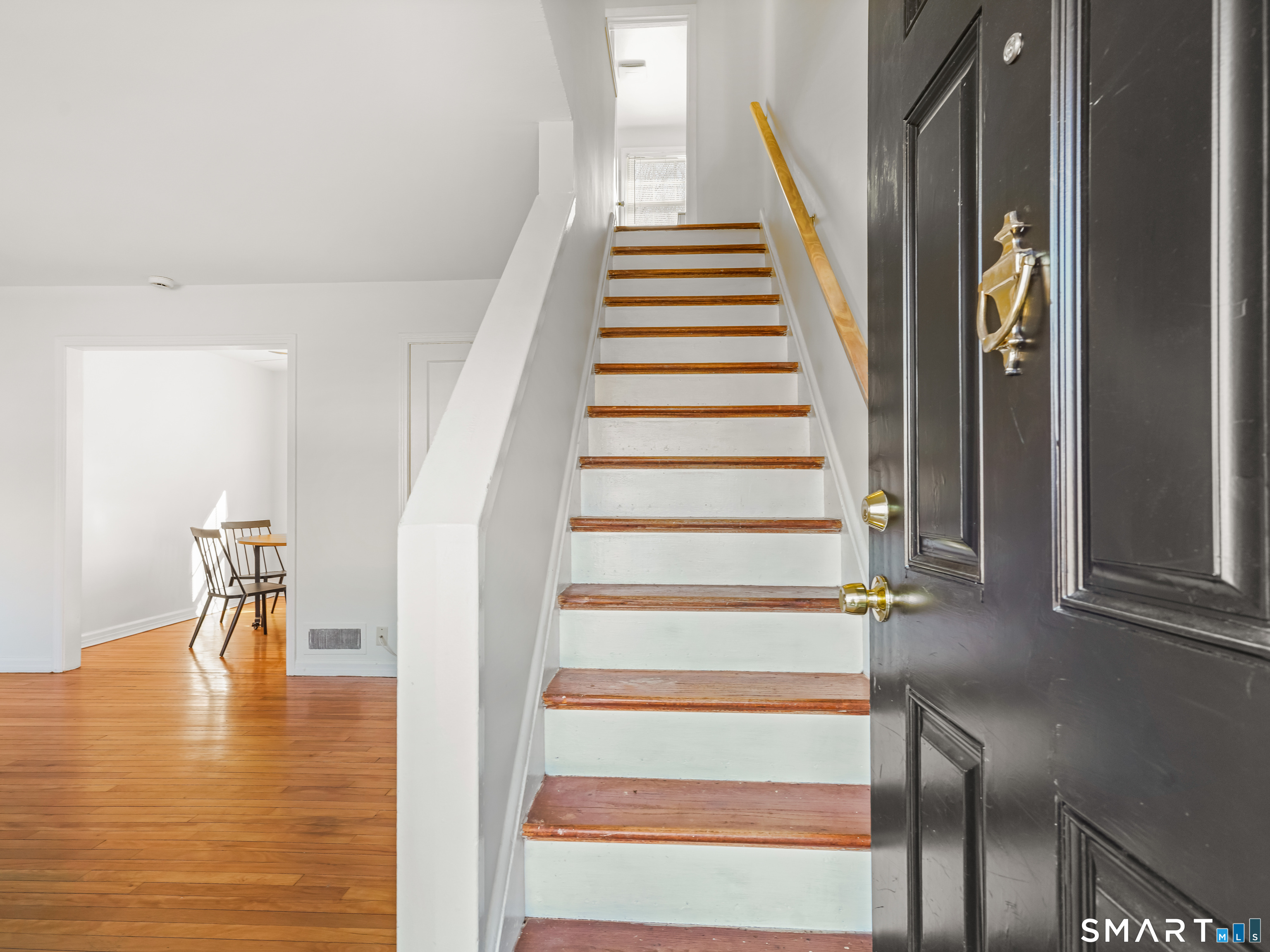 214 Sylvan Knoll Road, Unit 214 Stamford, CT 06902 - Photo 2 of 30 a view of entryway and hall with wooden floor