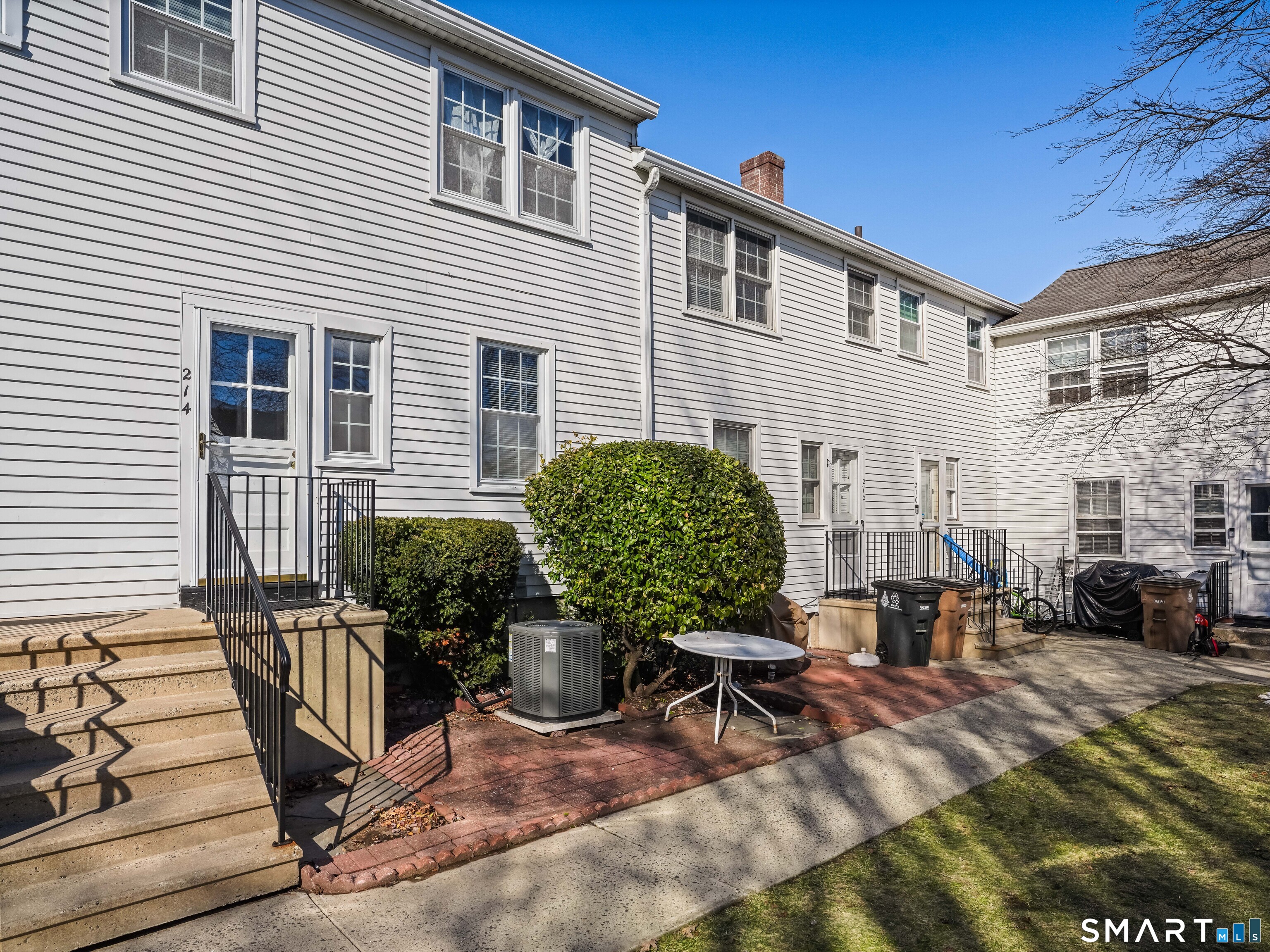 214 Sylvan Knoll Road, Unit 214 Stamford, CT 06902 - Photo 21 of 30 a view of a house with backyard and sitting area