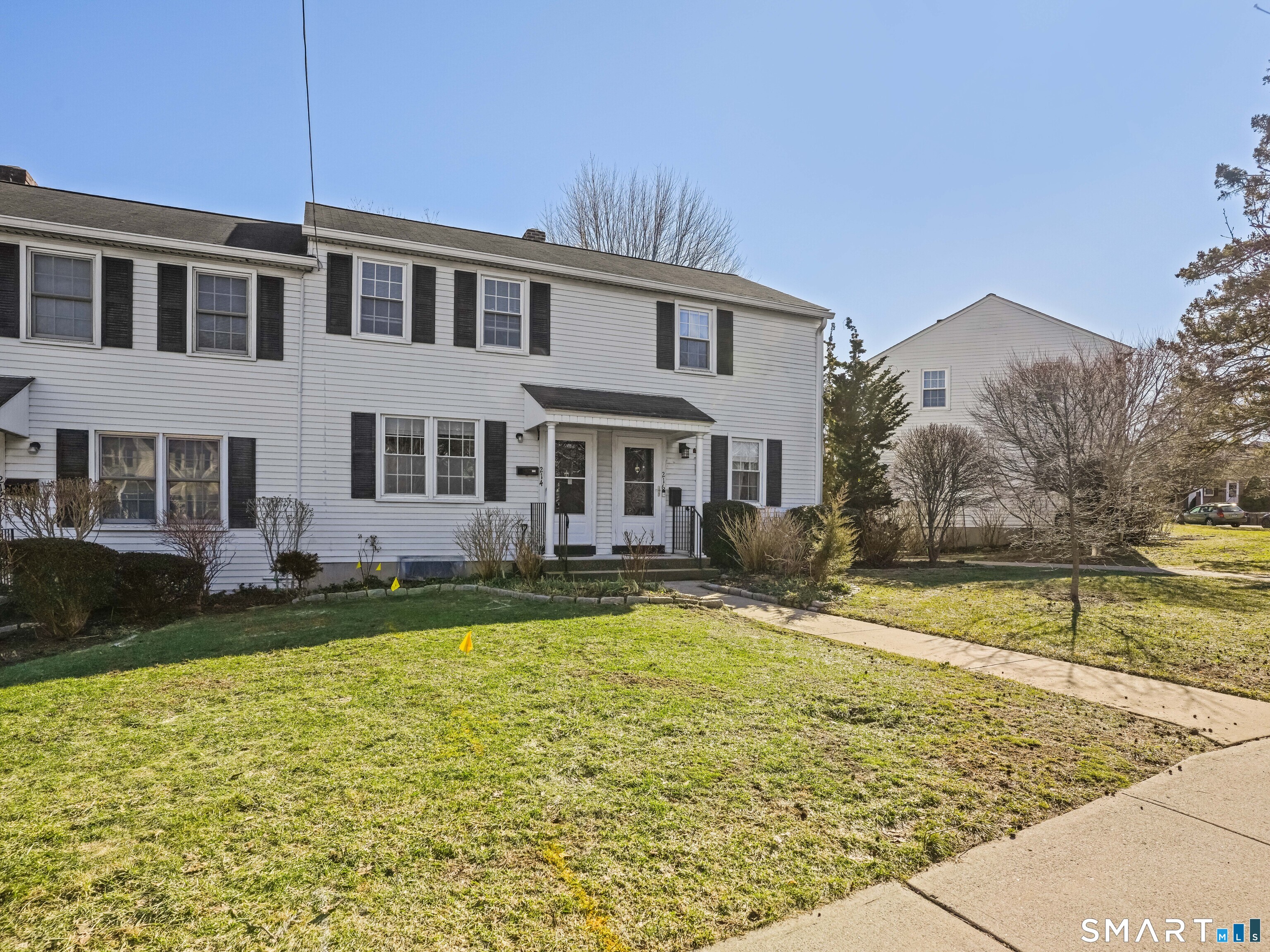 214 Sylvan Knoll Road, Unit 214 Stamford, CT 06902 - Photo 24 of 30 a view of a house with a swimming pool