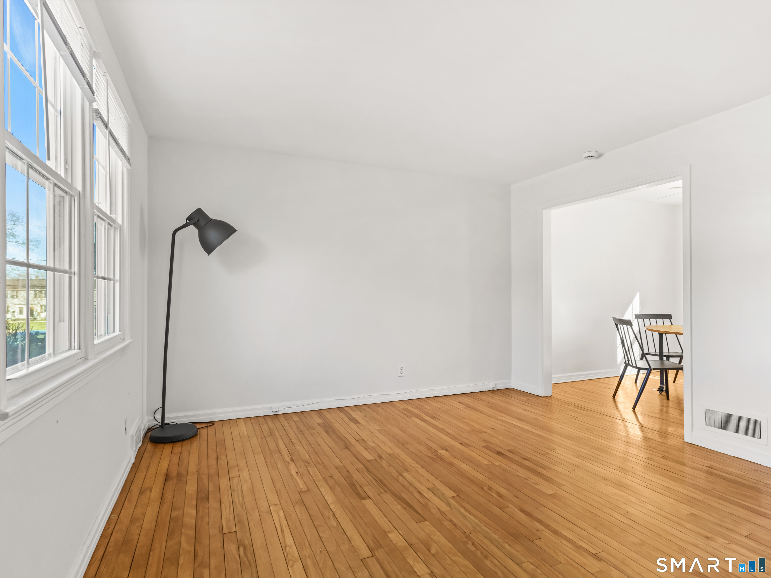 214 Sylvan Knoll Road, Unit 214 Stamford, CT 06902 - Photo 30 of 30 a view of empty room with wooden floor and fan