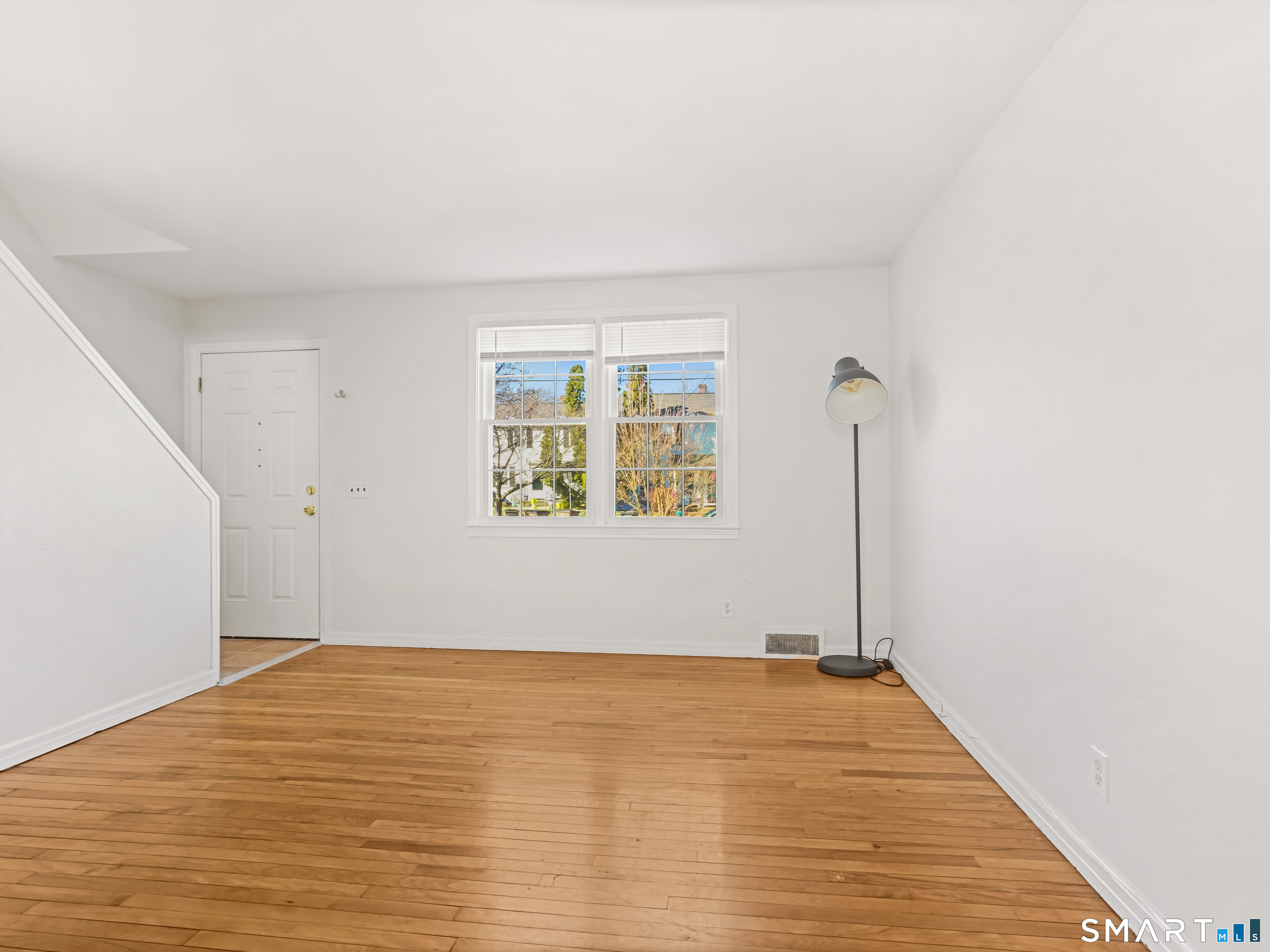 214 Sylvan Knoll Road, Unit 214 Stamford, CT 06902 - Photo 4 of 30 an empty room with a window