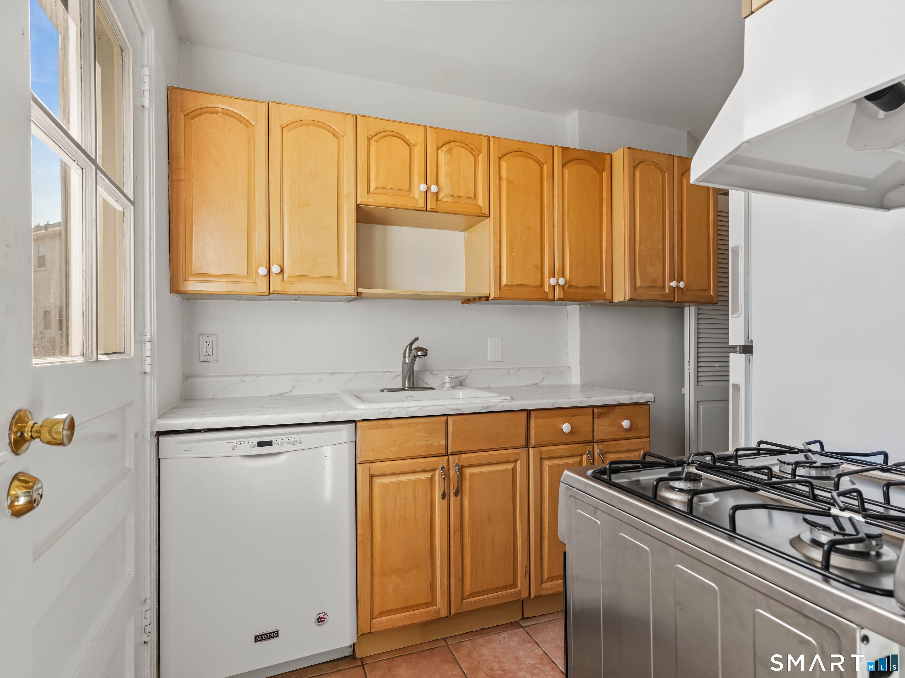 214 Sylvan Knoll Road, Unit 214 Stamford, CT 06902 - Photo 10 of 30 a kitchen with granite countertop cabinets and steel stainless steel appliances