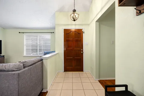 a bathroom with a sink a mirror and a window