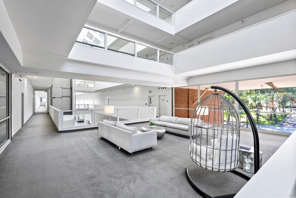 42 8th Street, Unit 1301 Boston, MA 02129 - Photo 12 of 23 a living room with furniture and a large window