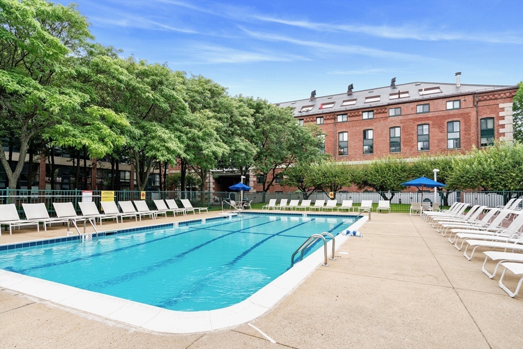 42 8th Street, Unit 1301 Boston, MA 02129 - Photo 14 of 23 a view of a swimming pool with a patio
