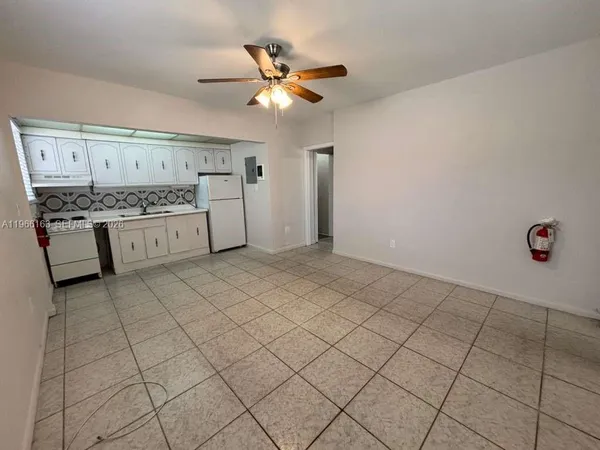 a view of a kitchen with a sink and a stove top oven
