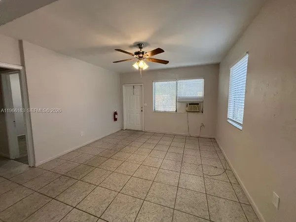 a view of an empty room with a window