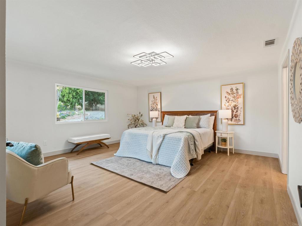 13737 Temple Street Poway, CA 92064 - Photo 16 of 38 a bedroom with bed and window